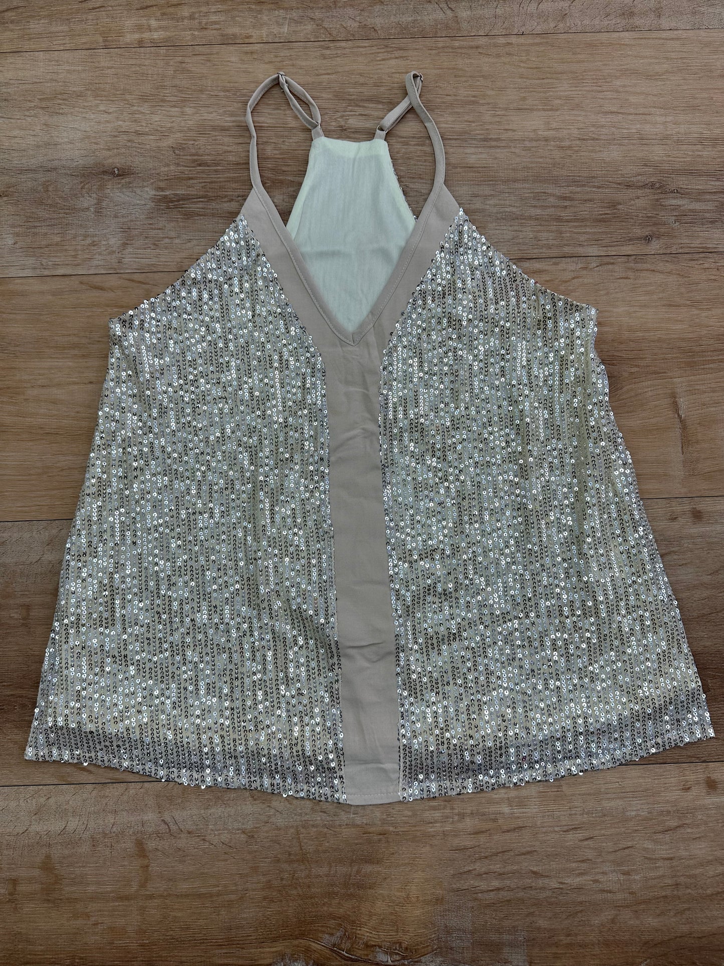 Blusa color crema claro, con brillo